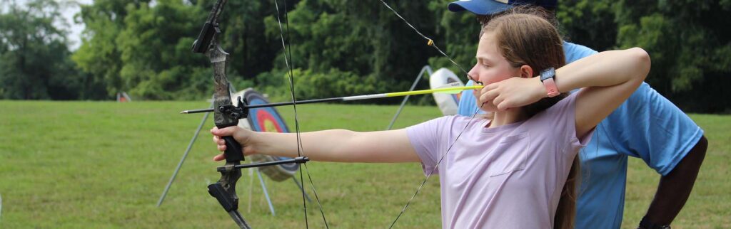 Photo of a girl with an archery bow