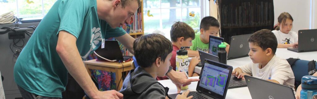 Photo of kids and staff in Computer class