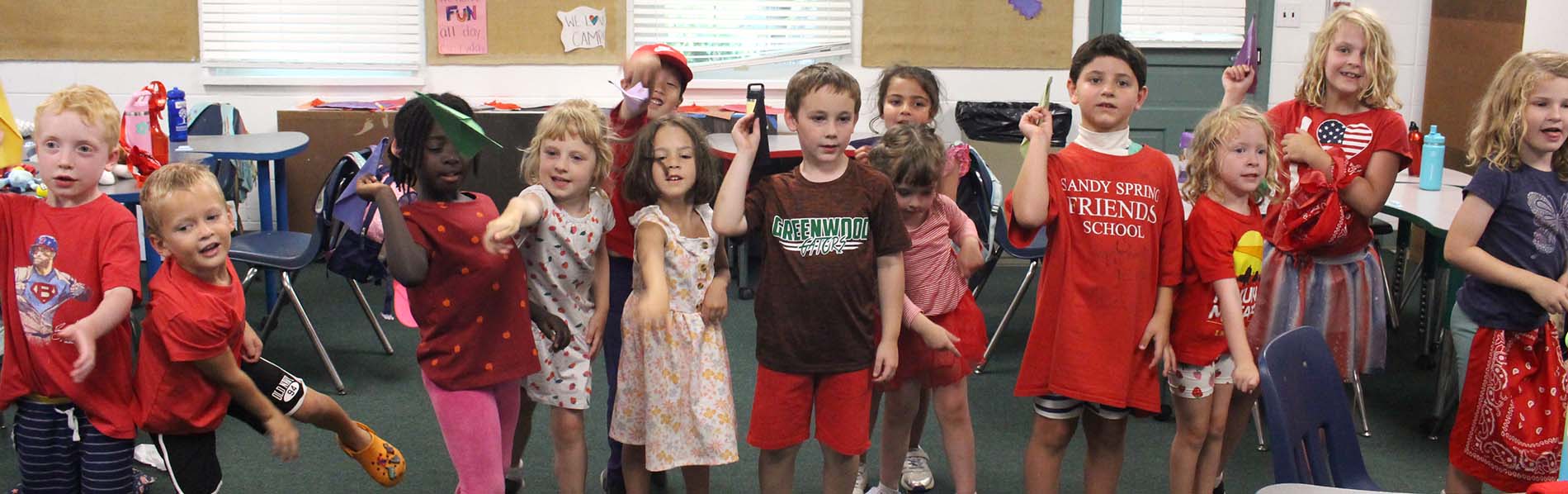 Photo of little kids flying paper planes